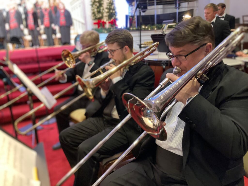 Trombones playing in church orchestra