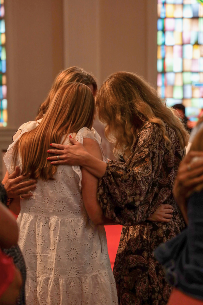 Ladies praying in a circle at Summerville Baptist in Summerville, SC